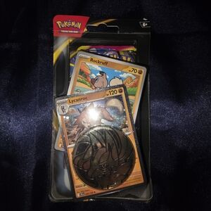 Pokemon 3 Card Set Blister Pacj with Lycanroc Coin - Orange and Black. Unopened